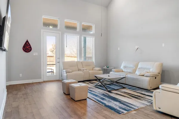 a living room with furniture rug and window