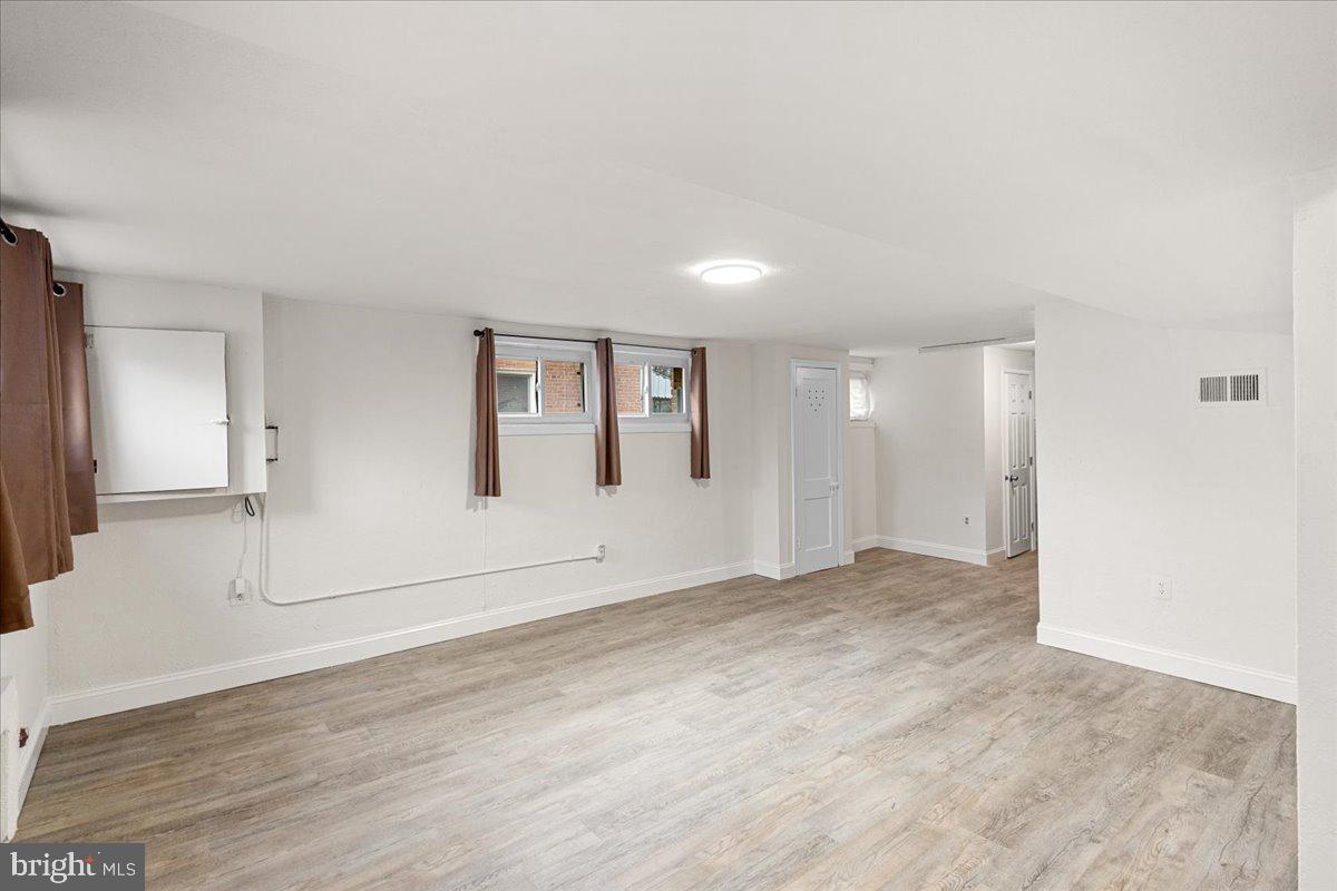 4027 D Street Southeast Washington, DC 20019 - Photo 22 of 32 a view of empty room with wooden floor