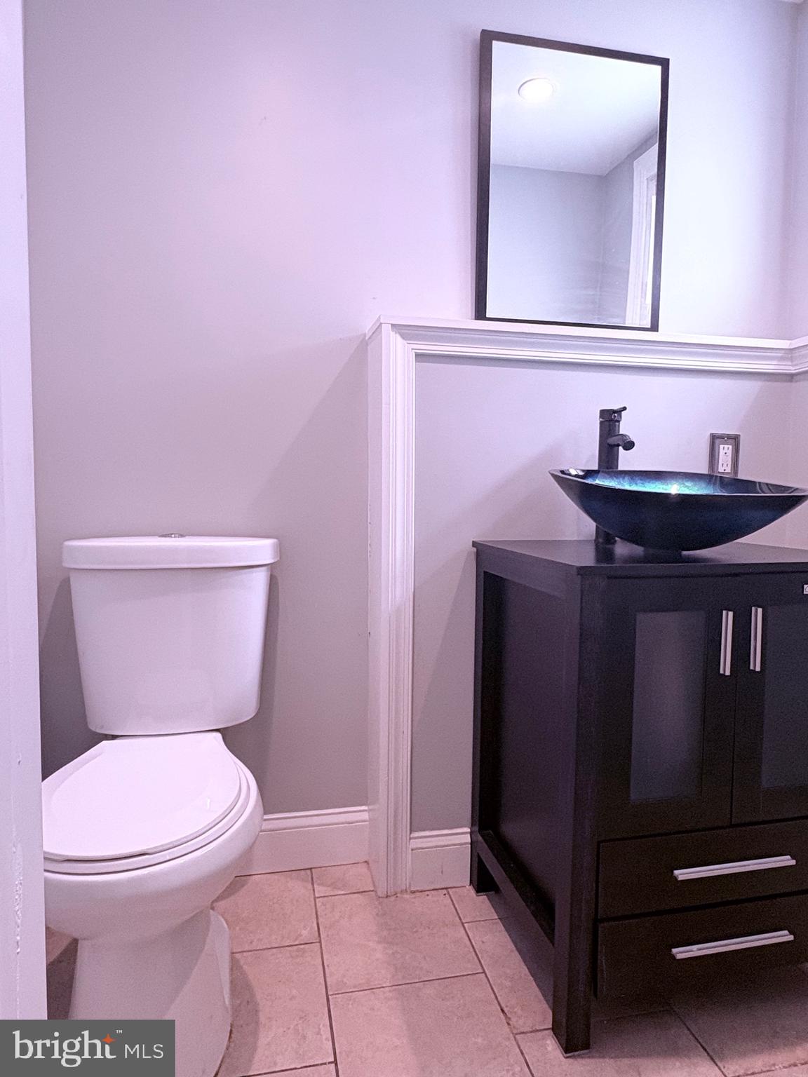 4027 D Street Southeast Washington, DC 20019 - Photo 32 of 32 a bathroom with a sink a toilet and mirror