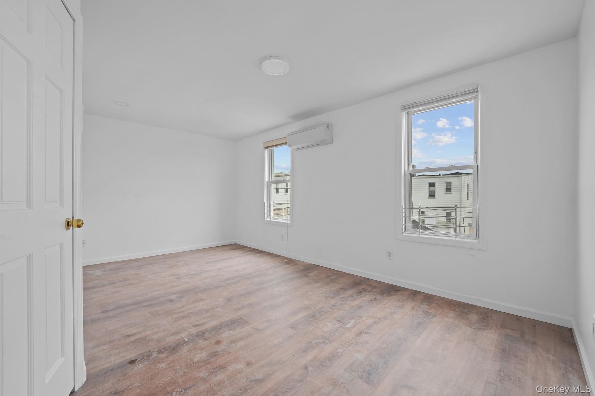 58-44 Fresh Pond Road Queens, NY 11378 - Photo 17 of 25 an empty room with windows
