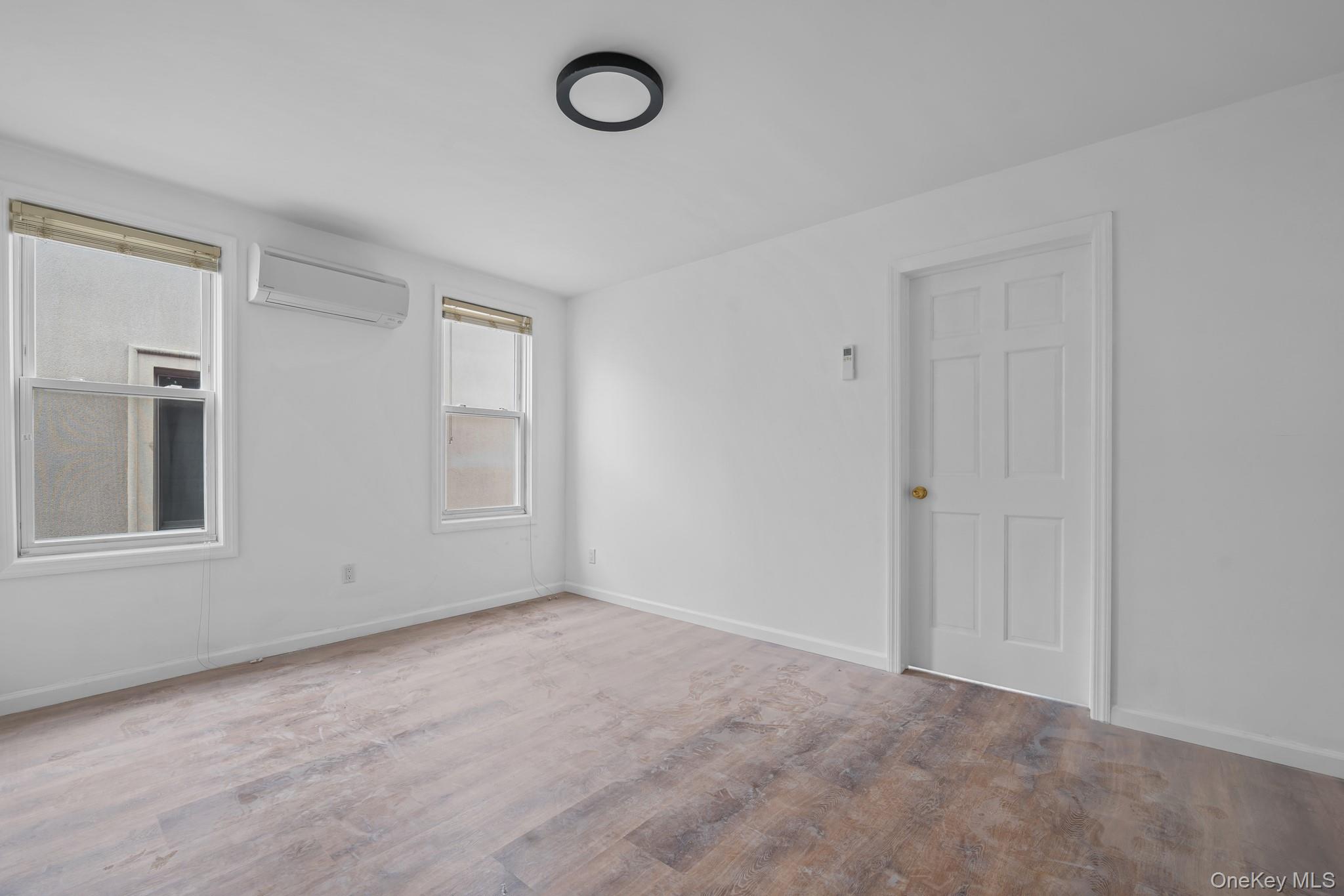 58-44 Fresh Pond Road Queens, NY 11378 - Photo 19 of 25 a view of an empty room with a window