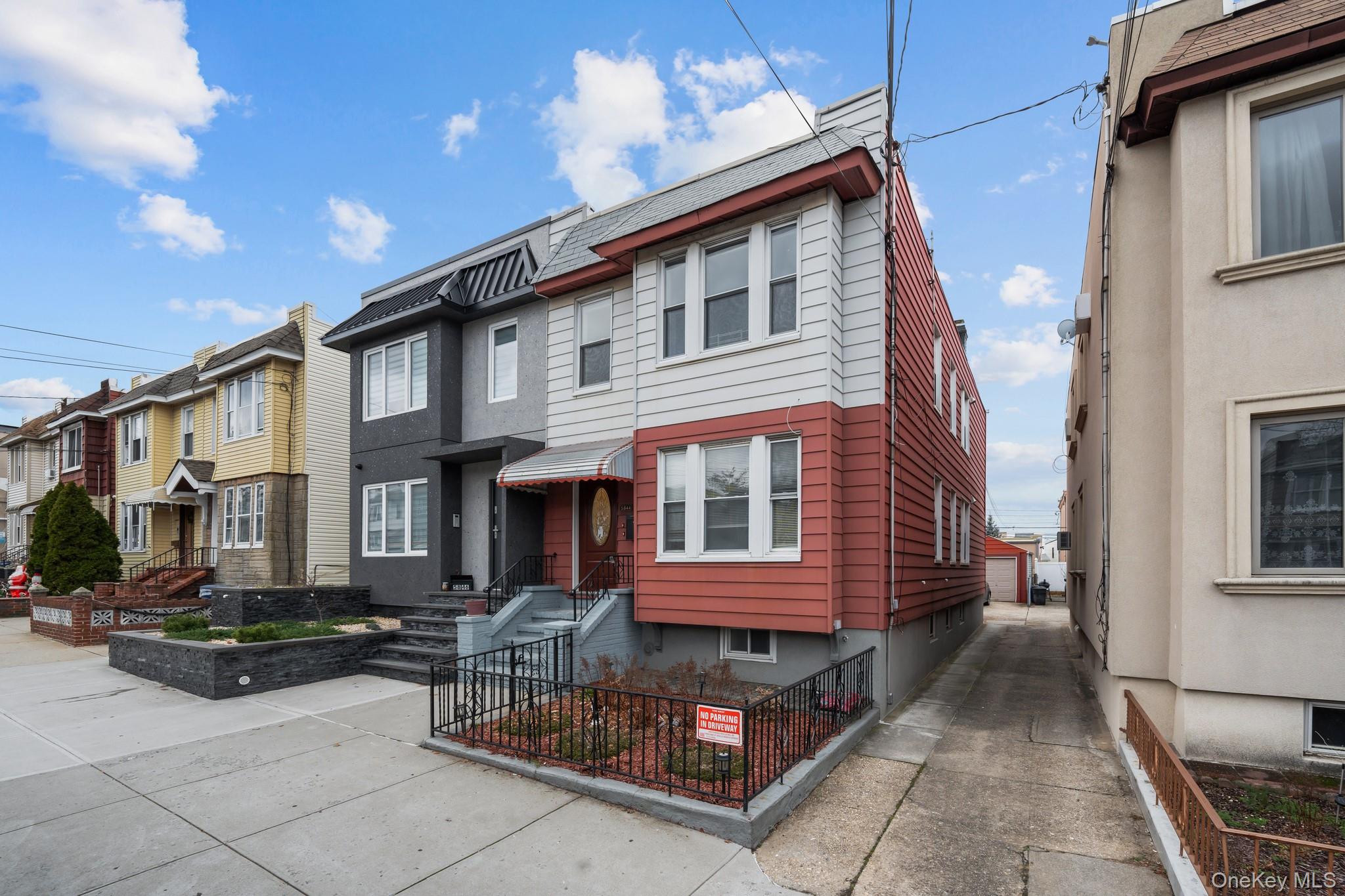 58-44 Fresh Pond Road Queens, NY 11378 - Photo 28 of 30 a view of a white building with a large windows