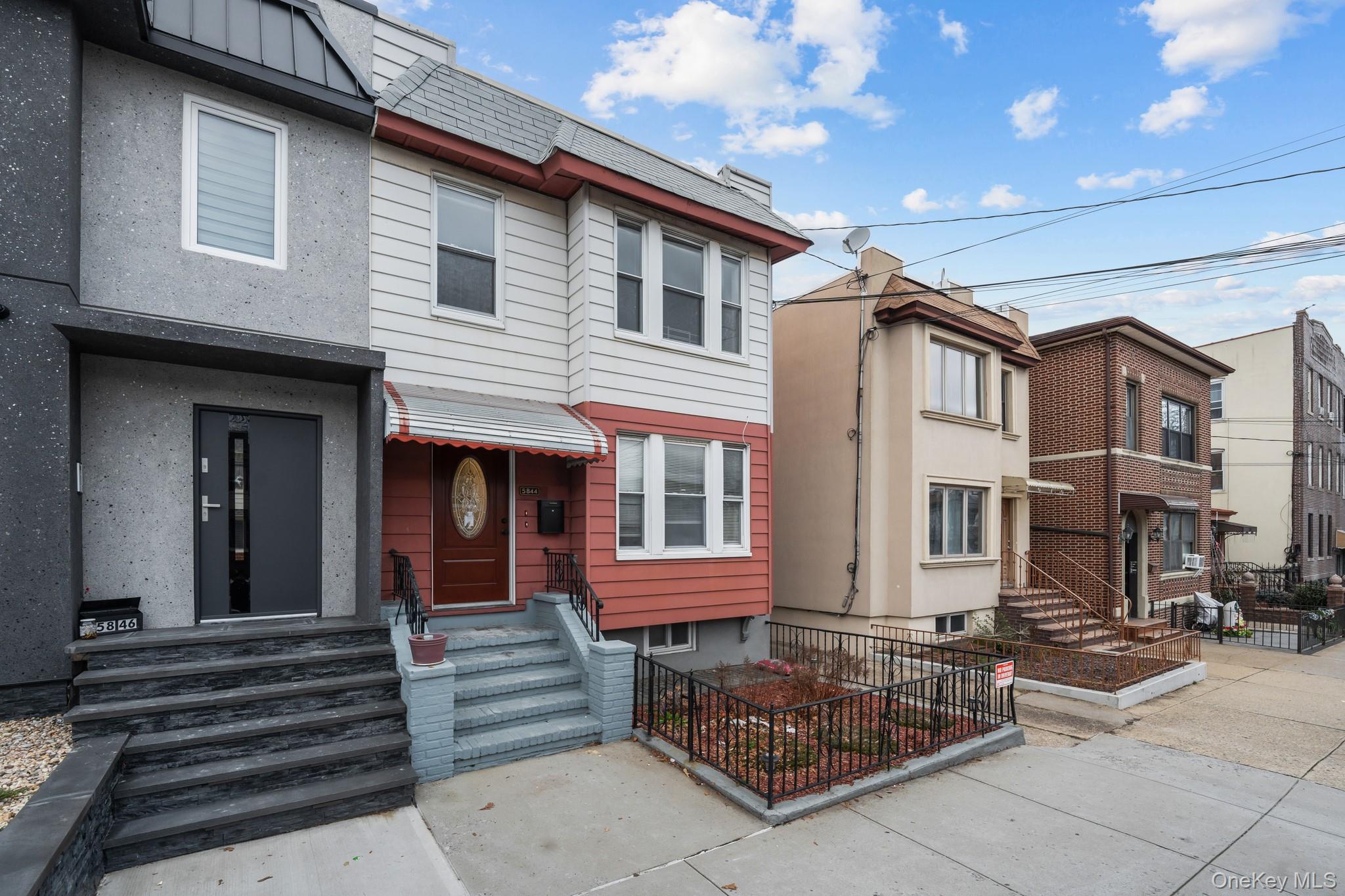 58-44 Fresh Pond Road Queens, NY 11378 - Photo 29 of 30 a view of front a house with outdoor seating