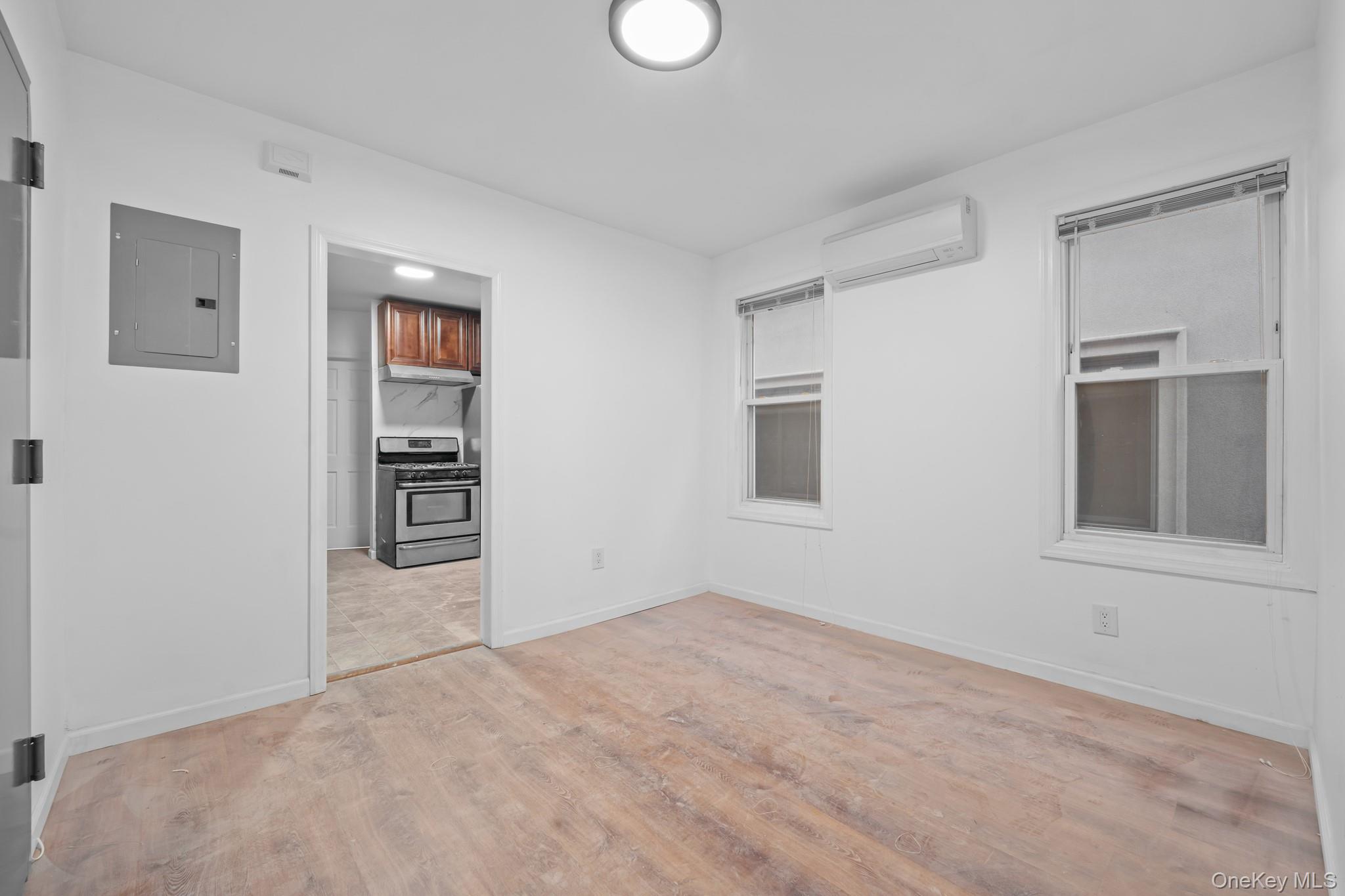 58-44 Fresh Pond Road Queens, NY 11378 - Photo 4 of 30 a view of an empty room with a window