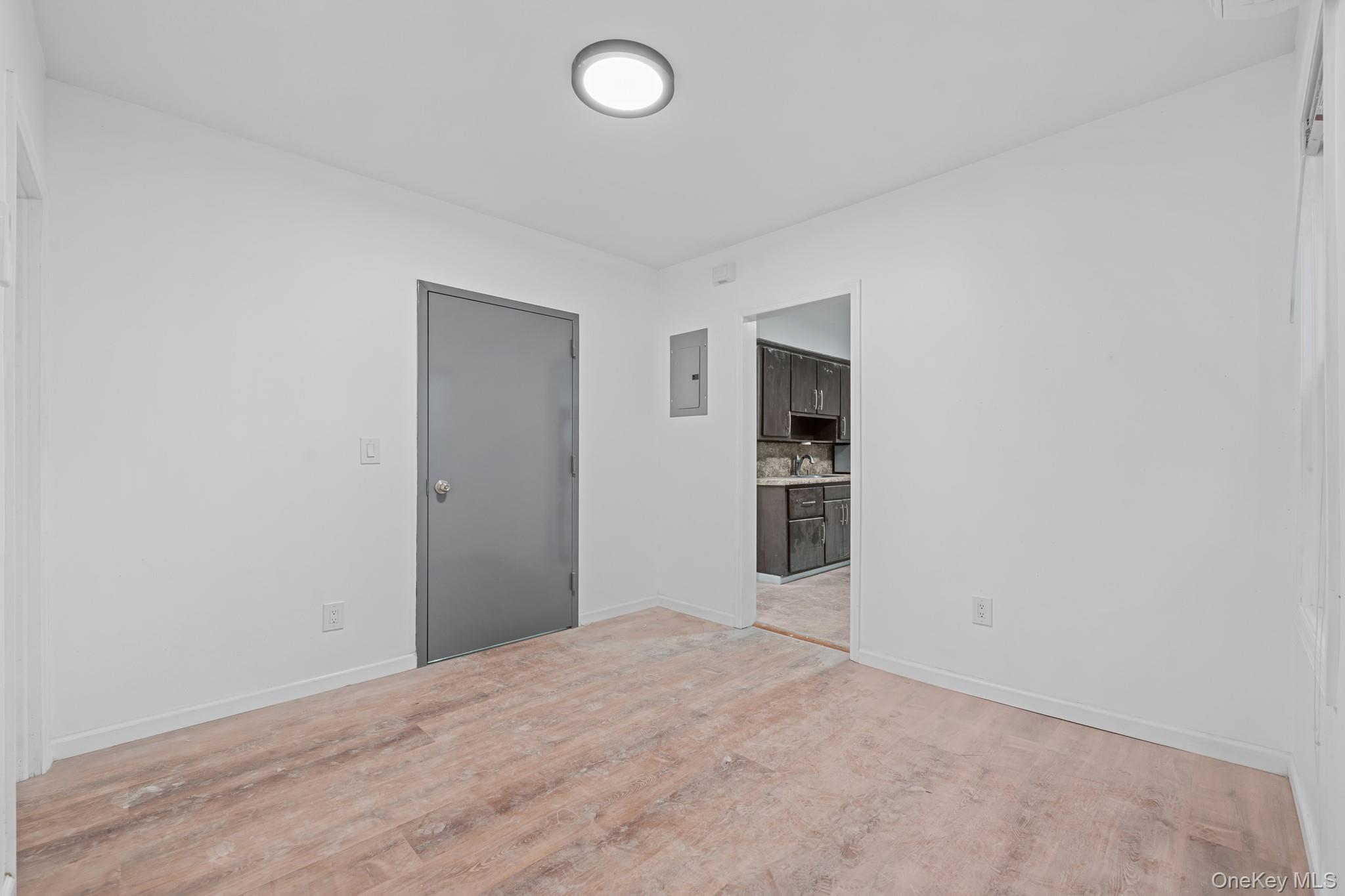 58-44 Fresh Pond Road Queens, NY 11378 - Photo 5 of 30 wooden floor in an empty room