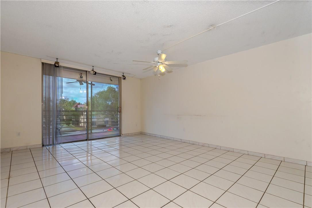 3285 Foxcroft Road, Unit E317 Miramar, FL 33025 - Photo 1 of 28 a view of an empty room and window