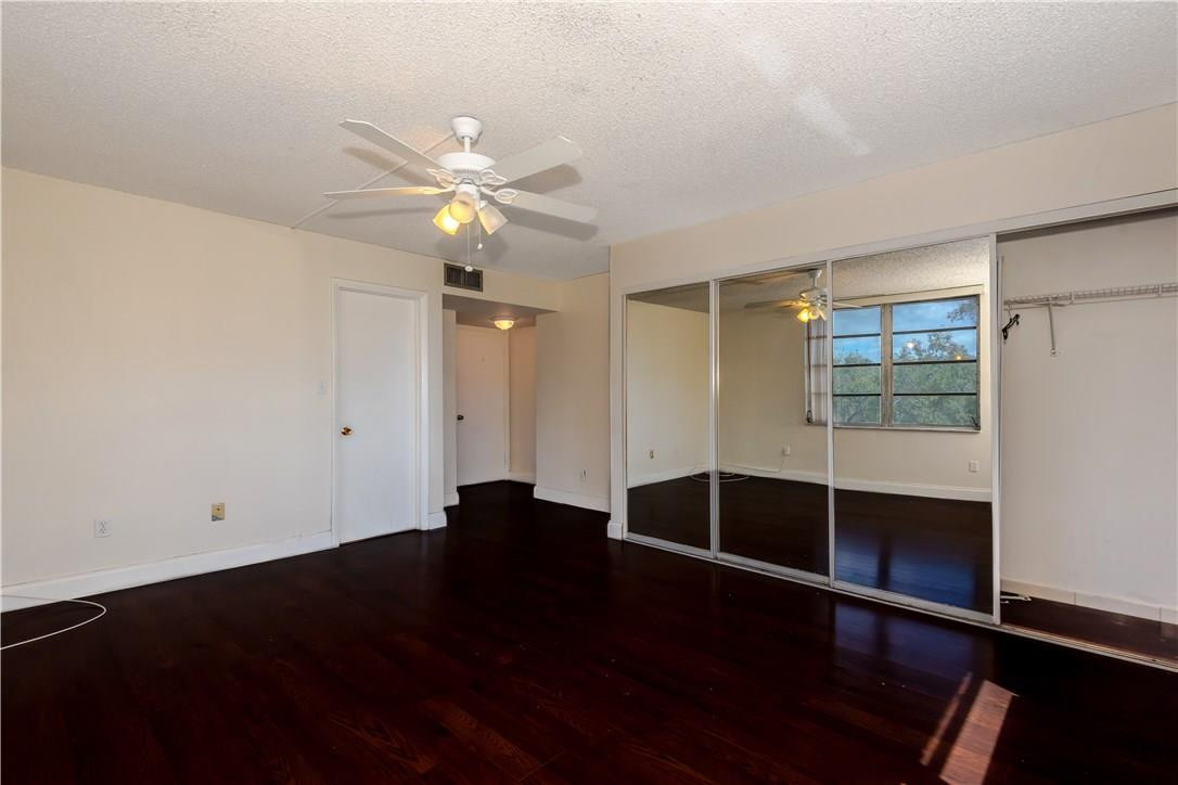 3285 Foxcroft Road, Unit E317 Miramar, FL 33025 - Photo 15 of 28 wooden floor in an empty room