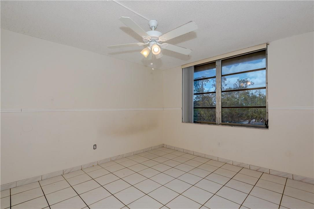 3285 Foxcroft Road, Unit E317 Miramar, FL 33025 - Photo 20 of 28 a view of an empty room with a window