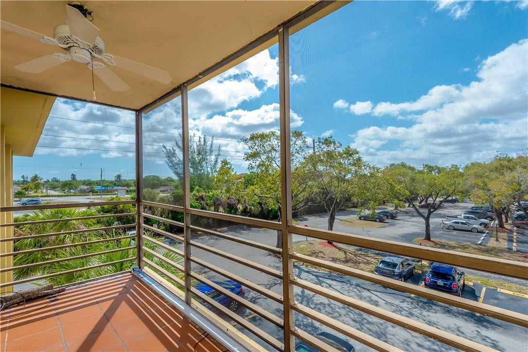 3285 Foxcroft Road, Unit E317 Miramar, FL 33025 - Photo 26 of 28 a view of a balcony with lake view
