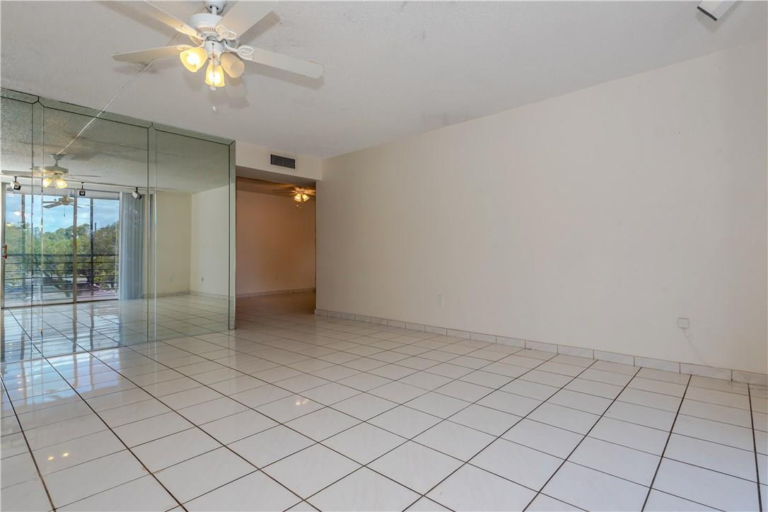 3285 Foxcroft Road, Unit E317 Miramar, FL 33025 - Photo 4 of 28 a view of an empty room and window