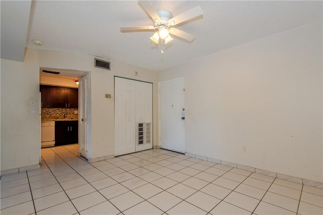 3285 Foxcroft Road, Unit E317 Miramar, FL 33025 - Photo 6 of 28 a view of an empty room and kitchen view