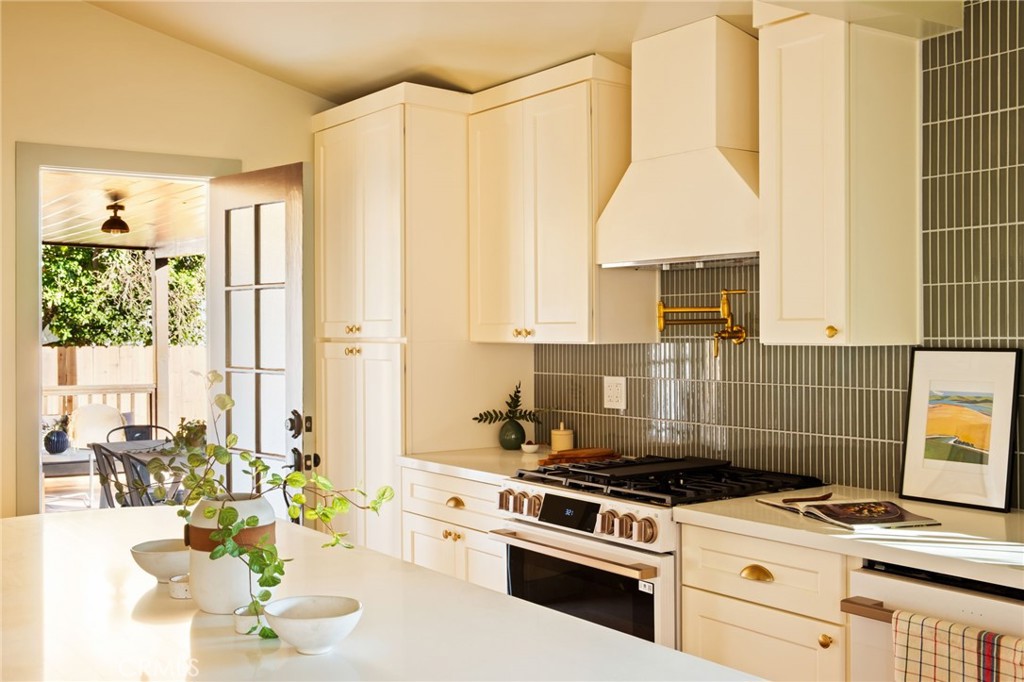 1578 Morada Place Altadena, CA 91001 - Photo 15 of 58 a kitchen with a stove a refrigerator and a window