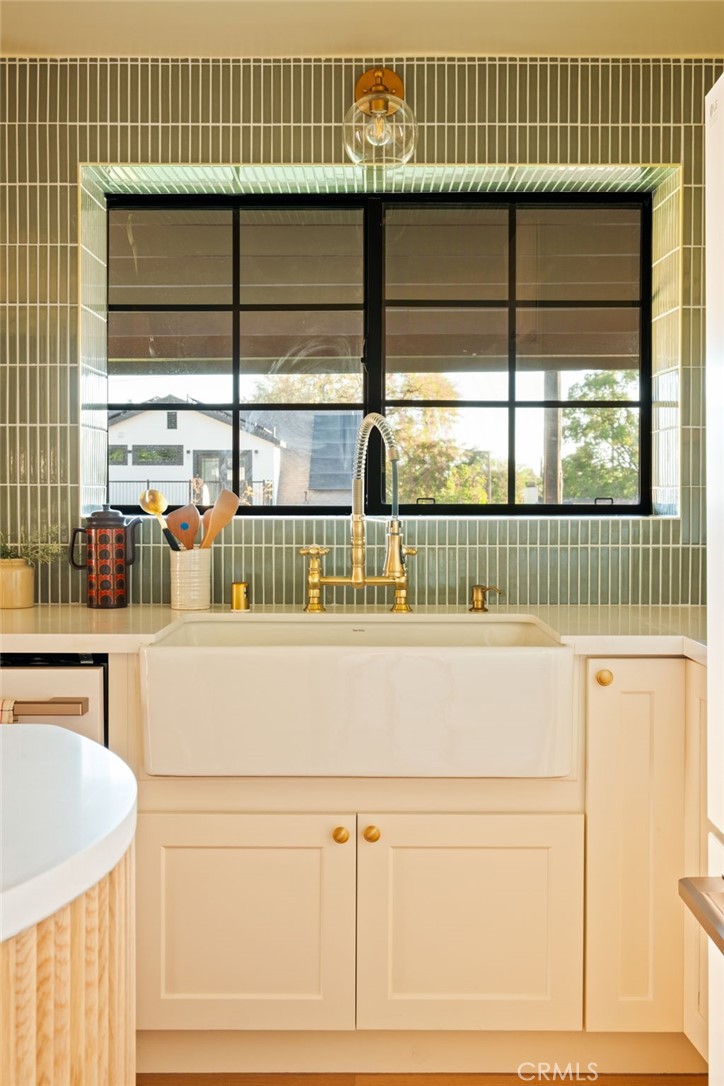 1578 Morada Place Altadena, CA 91001 - Photo 17 of 58 a close view of kitchen sink with dishwasher and white cabinets