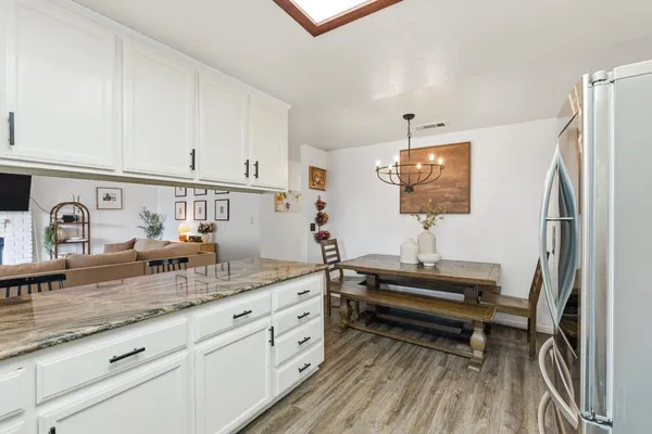 a kitchen with sink refrigerator and stove