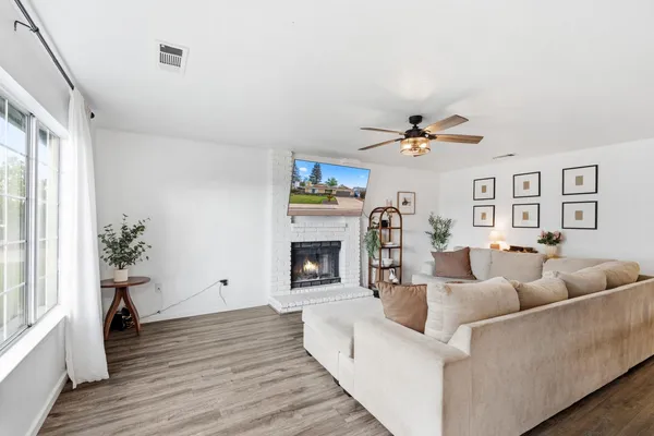 a living room with furniture and a fireplace