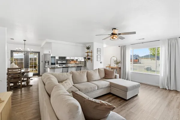 a living room with furniture and a large window