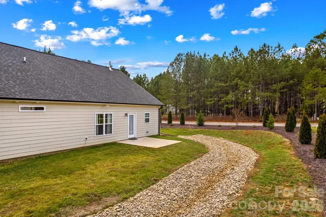 a view of a house with a yard porch and sitting area