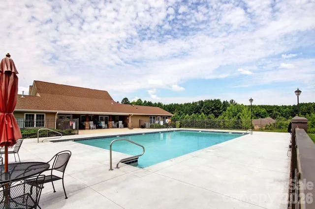 a view of outdoor space with playground and green space