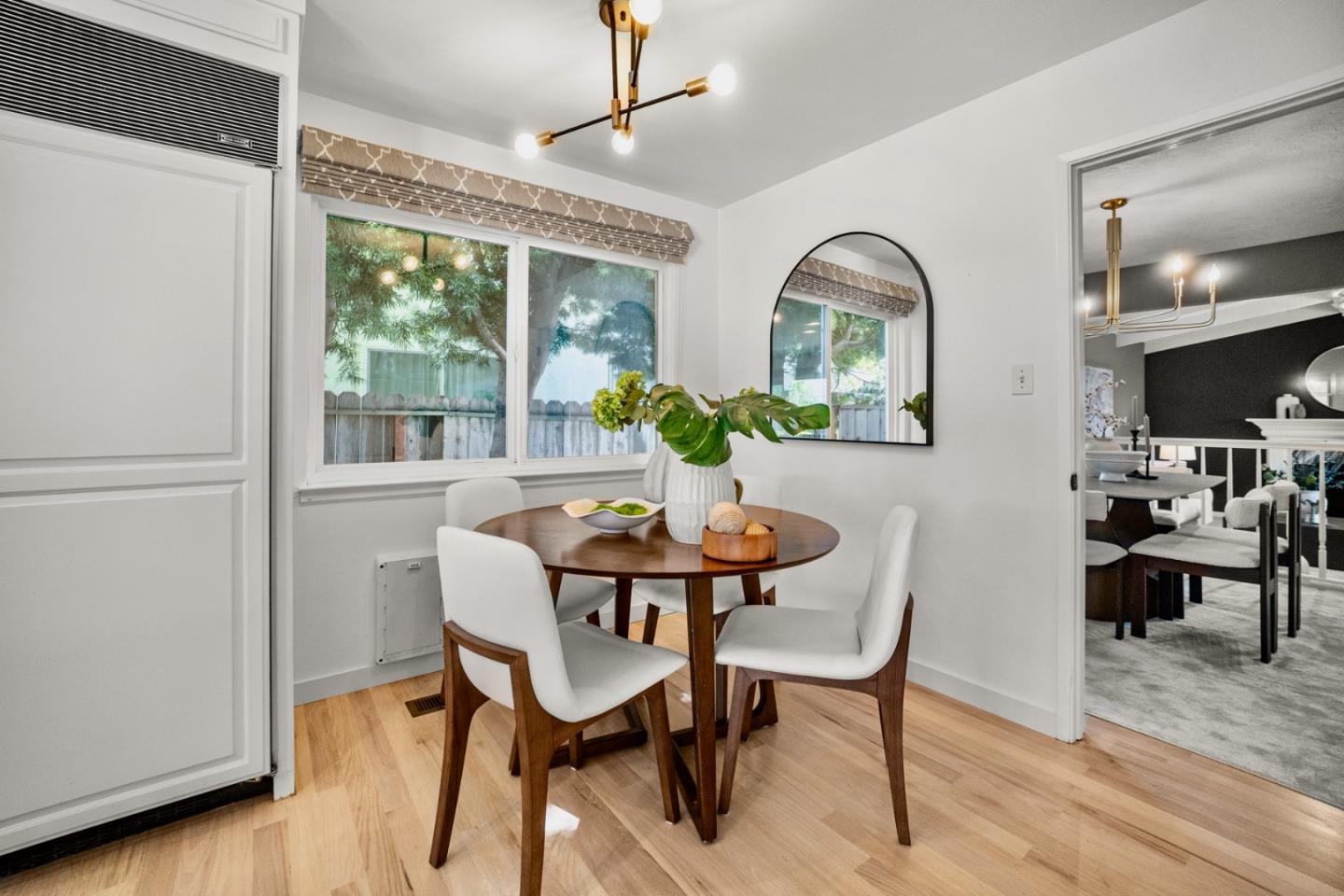 861 Haddock Street Foster City, CA 94404 - Photo 11 of 40 a view of a dining room with furniture window and wooden floor