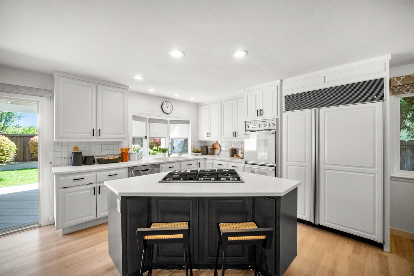861 Haddock Street Foster City, CA 94404 - Photo 13 of 40 a kitchen with a dining table chairs and refrigerator