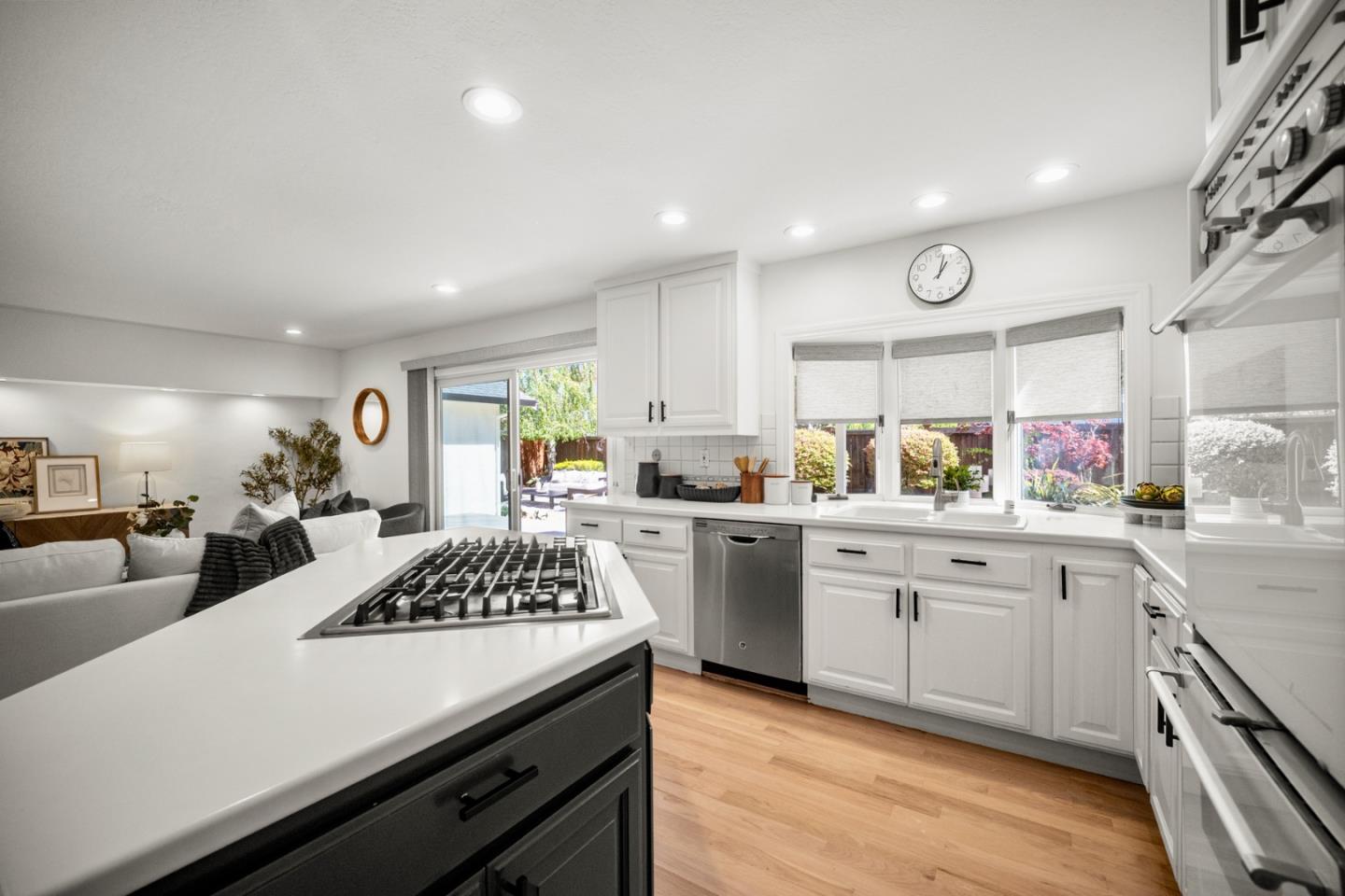 861 Haddock Street Foster City, CA 94404 - Photo 14 of 40 a kitchen with a sink stove and cabinets
