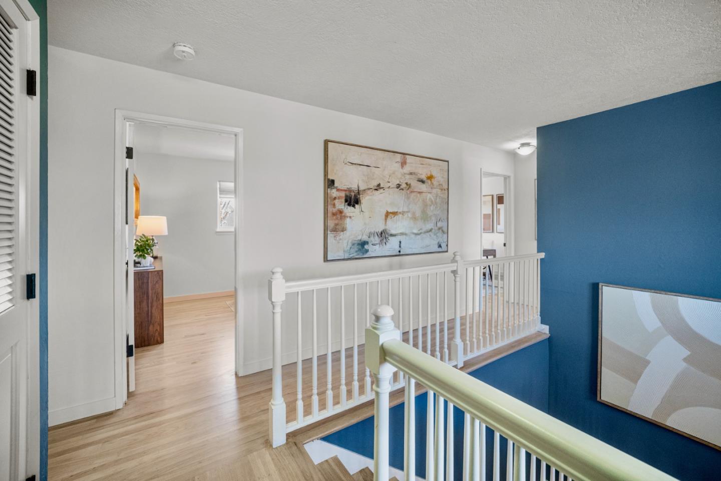 861 Haddock Street Foster City, CA 94404 - Photo 22 of 40 a view of a hallway with wooden floor and stairs