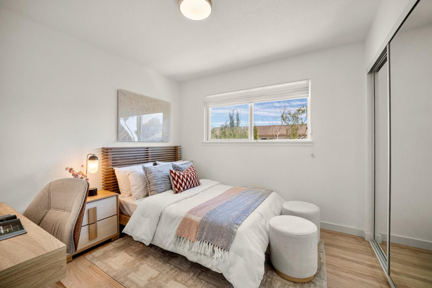 861 Haddock Street Foster City, CA 94404 - Photo 24 of 40 a bedroom with a bed and wooden floor