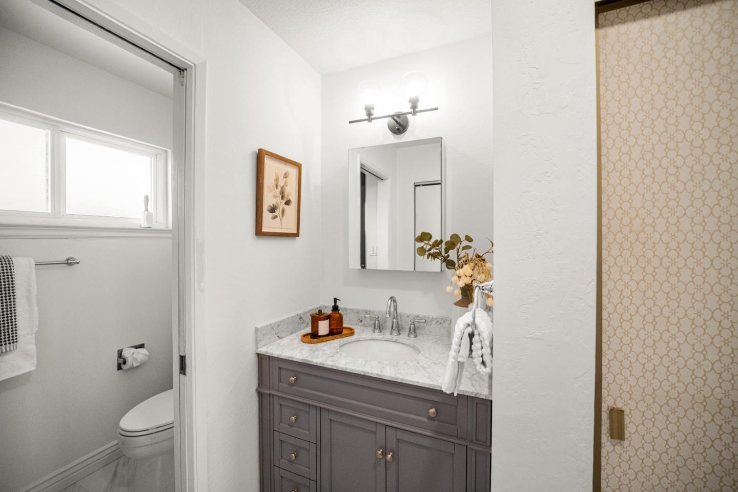 861 Haddock Street Foster City, CA 94404 - Photo 27 of 40 a bathroom with a granite countertop sink a toilet and a mirror
