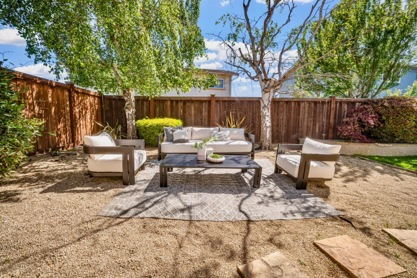 861 Haddock Street Foster City, CA 94404 - Photo 36 of 40 a view of a backyard with table and chairs and a fire pit