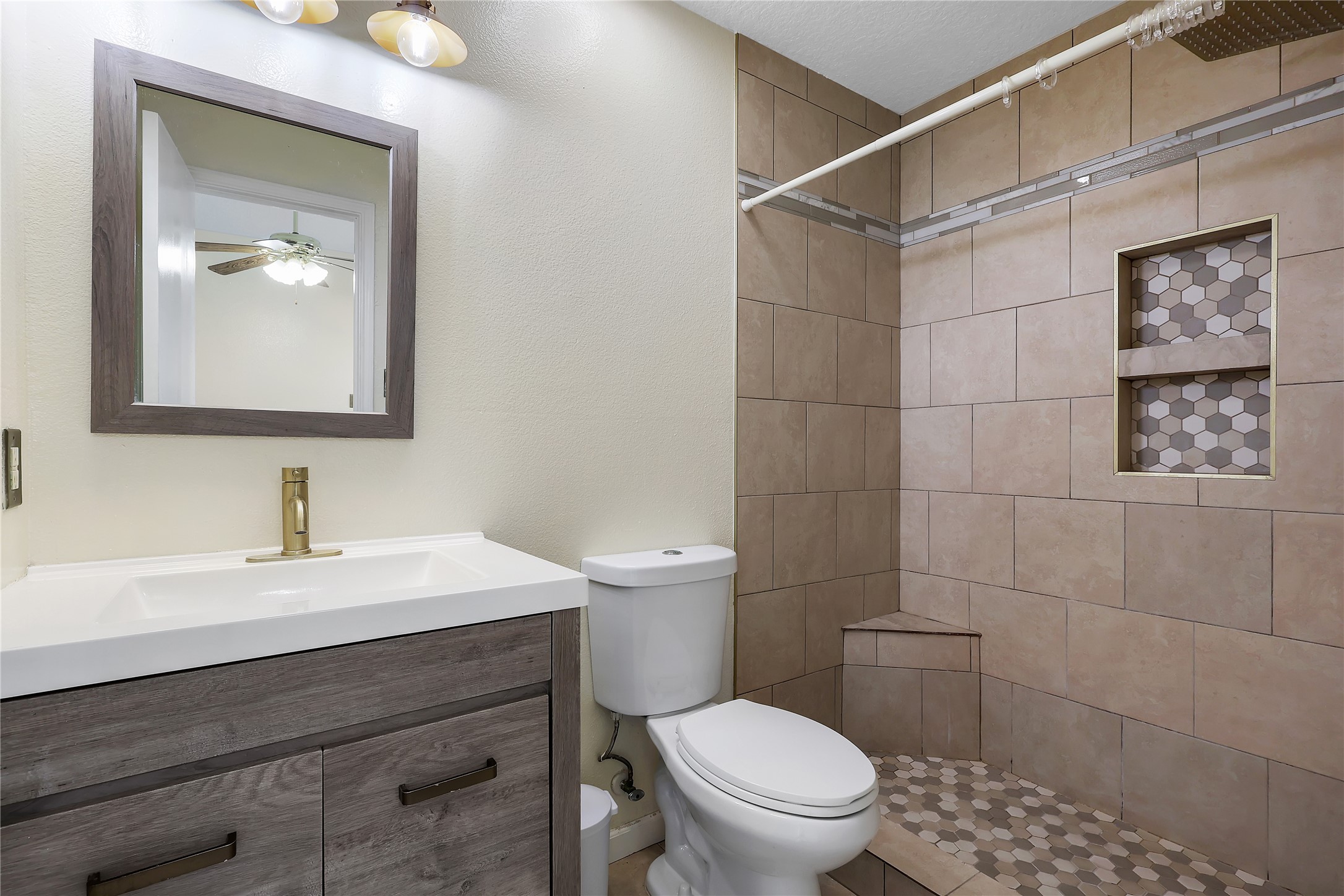 1117 Willersley Lane Channelview, TX 77530 - Photo 11 of 27 a bathroom with a sink mirror vanity and toilet