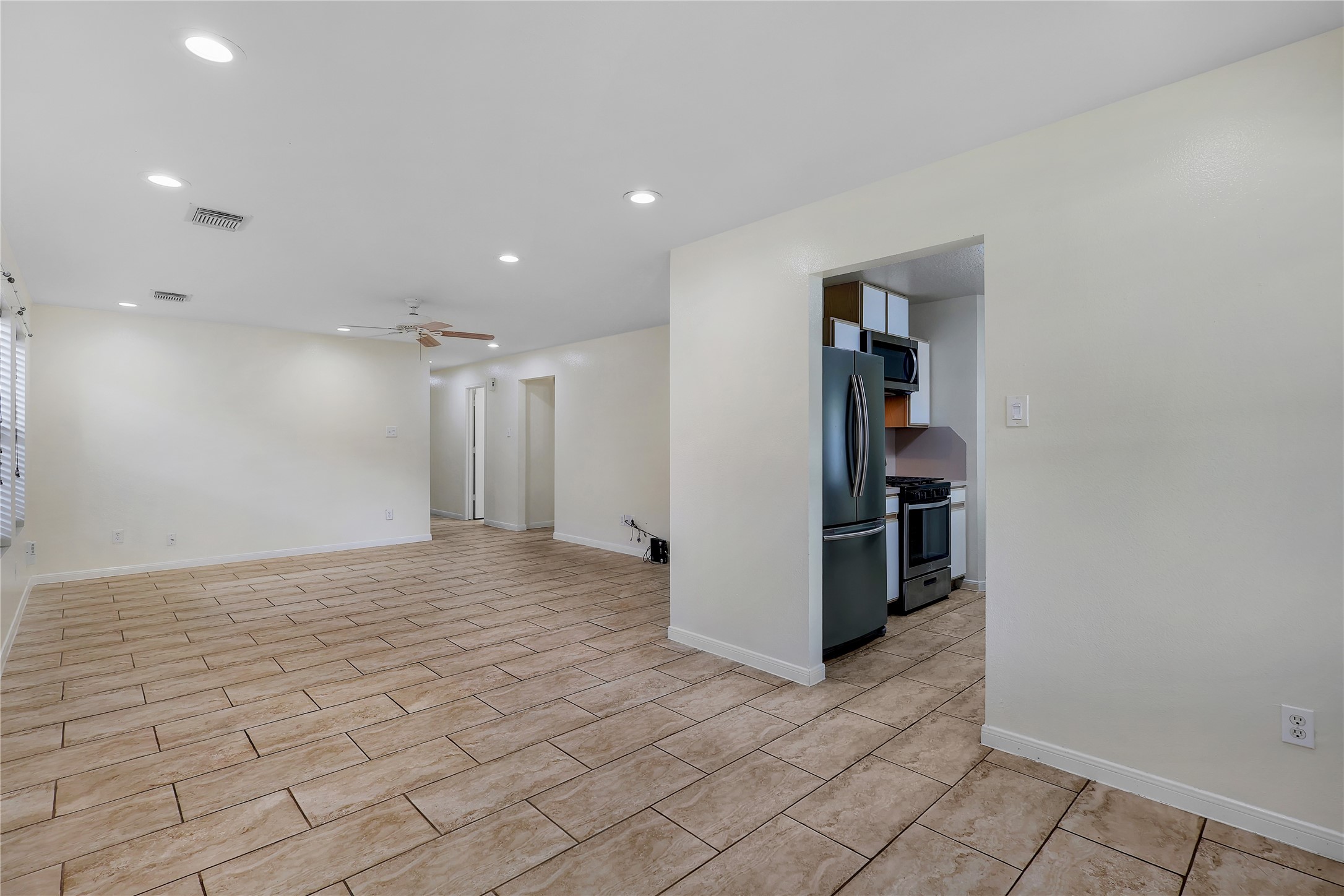 1117 Willersley Lane Channelview, TX 77530 - Photo 17 of 27 a view of a hallway with wooden shelves