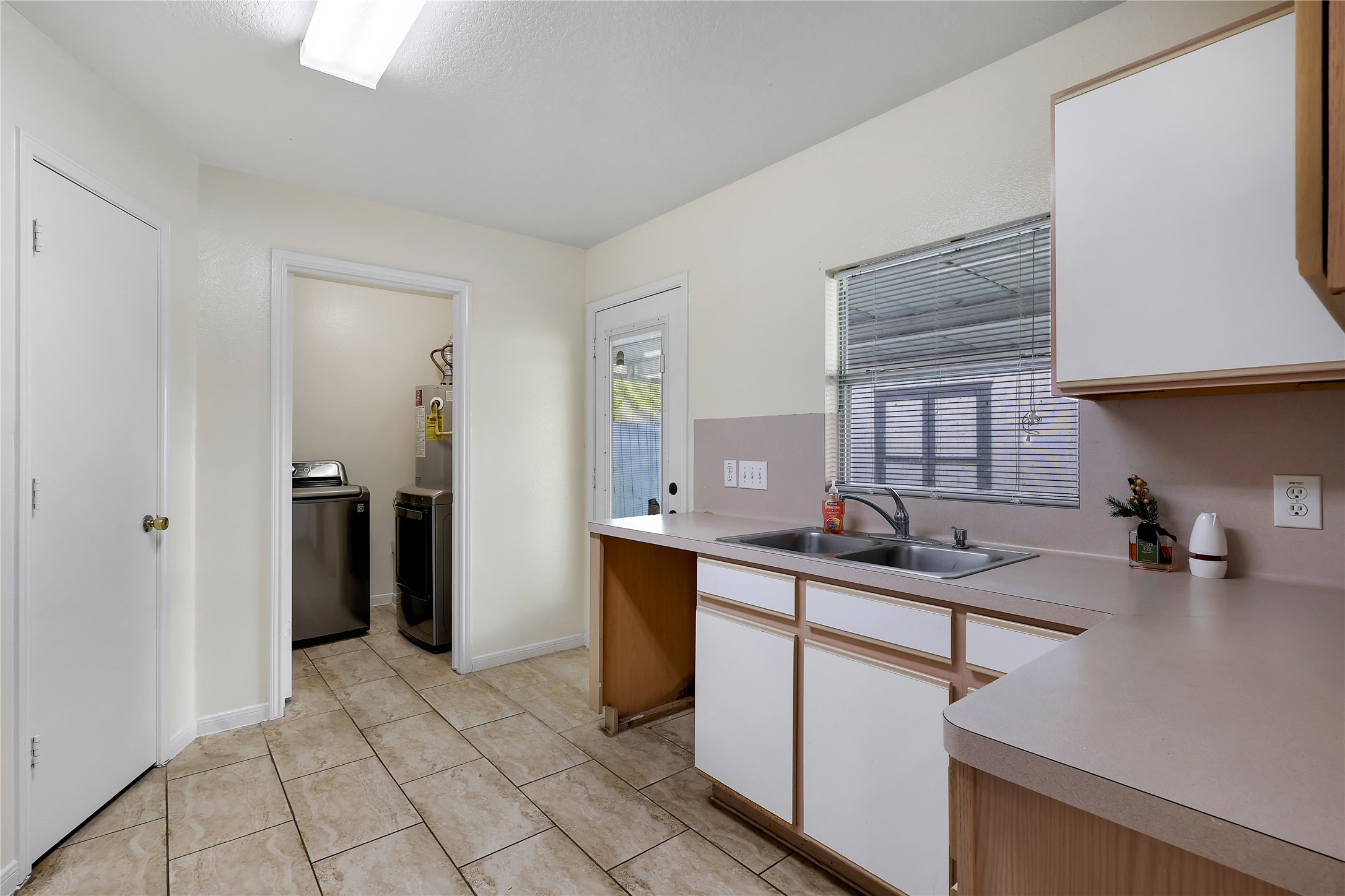 1117 Willersley Lane Channelview, TX 77530 - Photo 18 of 27 a kitchen with stainless steel appliances granite countertop a sink stove and cabinets