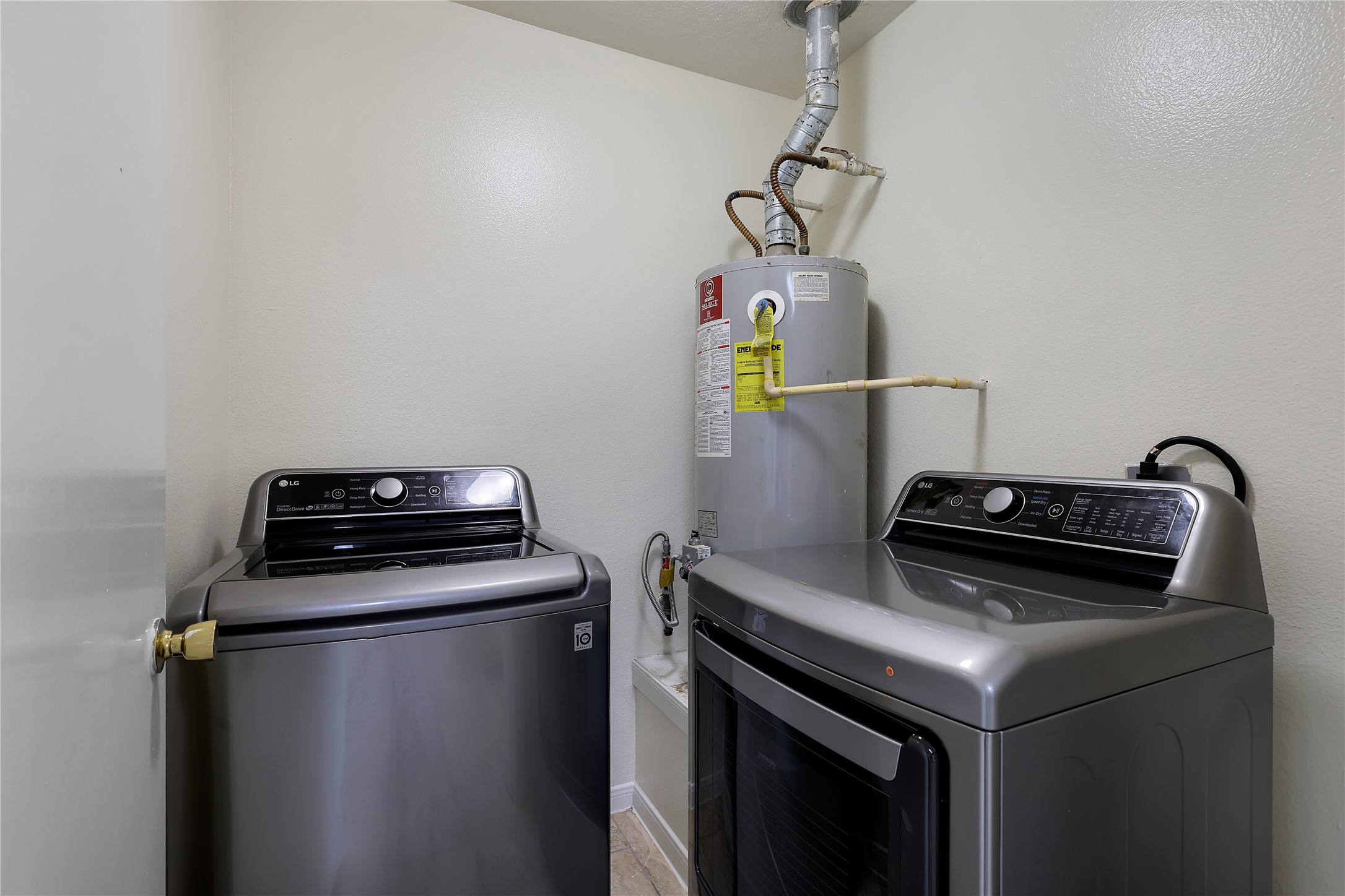 1117 Willersley Lane Channelview, TX 77530 - Photo 21 of 27 a view of storage and utility room with washer and dryer