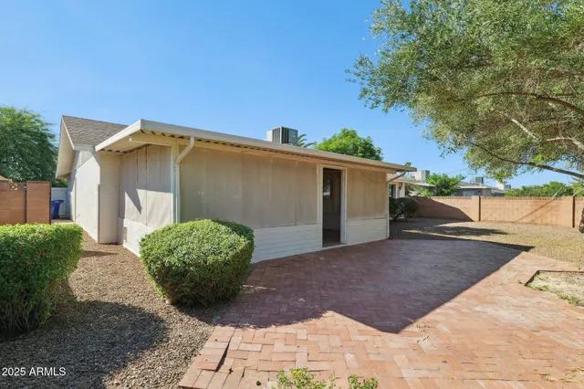 a view of a house with a yard and garage