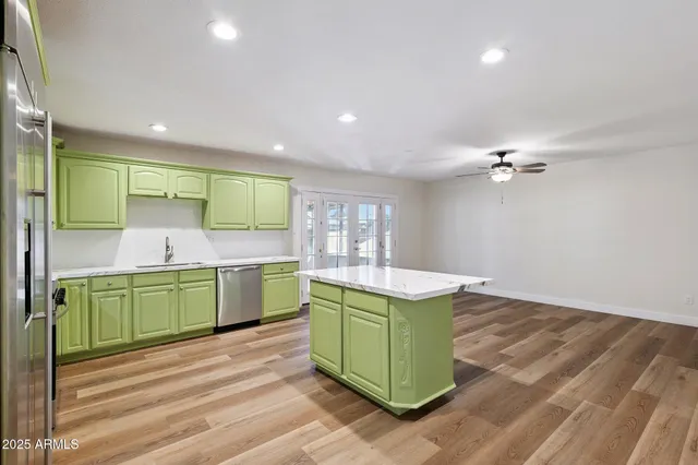 a kitchen with a cabinets and a sink