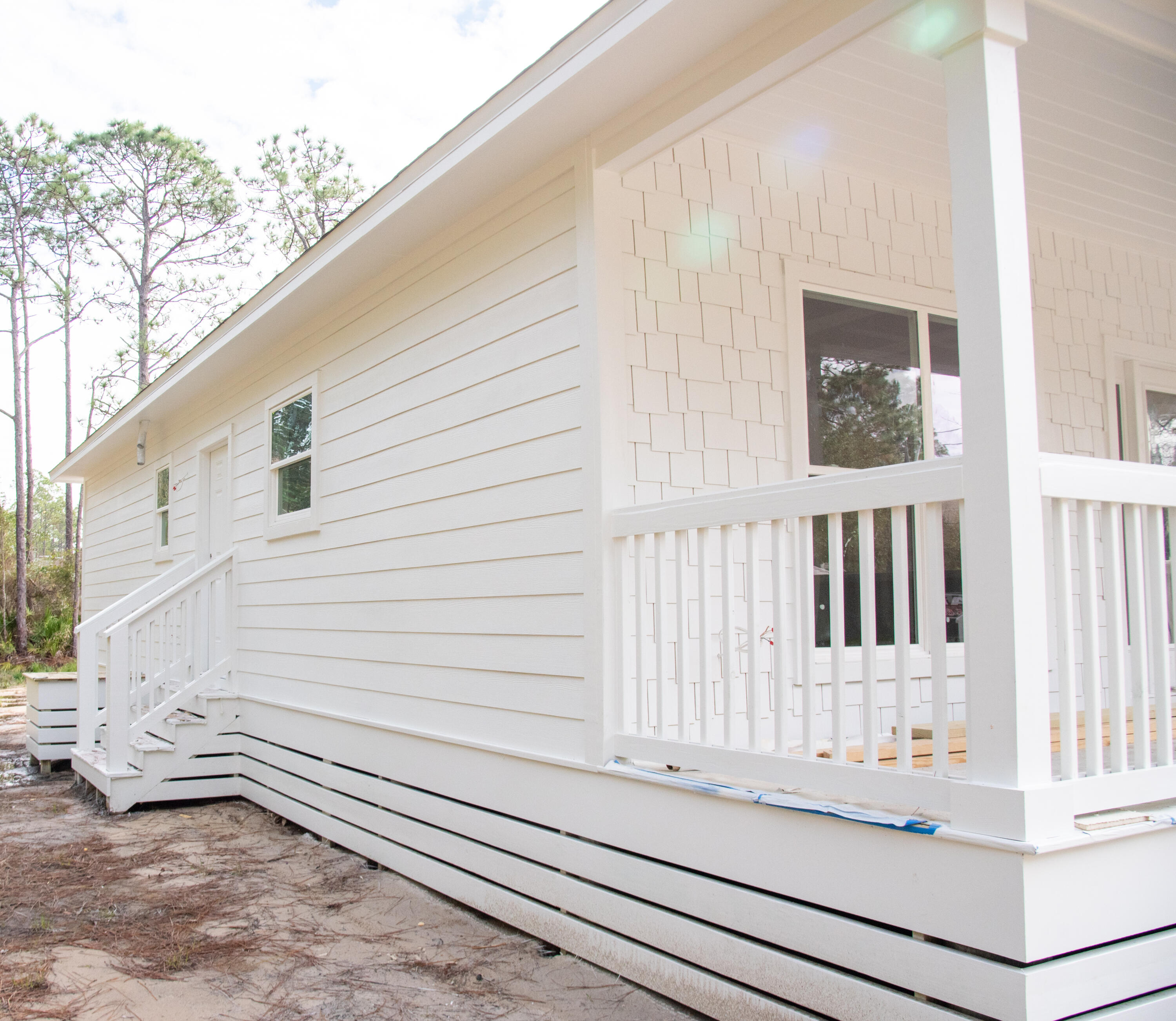 88 4th Street Santa Rosa Beach, FL 32459 - Photo 2 of 8 a view of wooden balcony and a floor to ceiling window