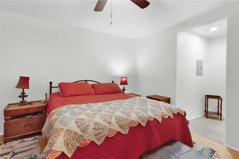 a bedroom with a bed and a lamp