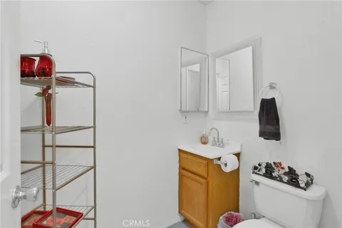 a bathroom with a sink toilet and vanity