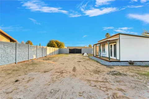 a view of a backyard of the house