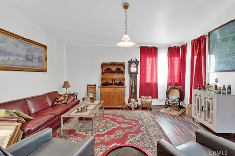 a bedroom with furniture and a window