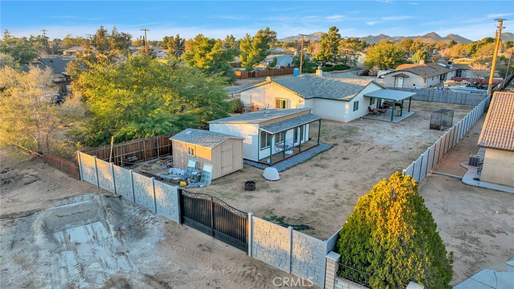 12887 Sholic Road Apple Valley, CA 92308 - Photo 43 of 47 aerial view of a house with a garden