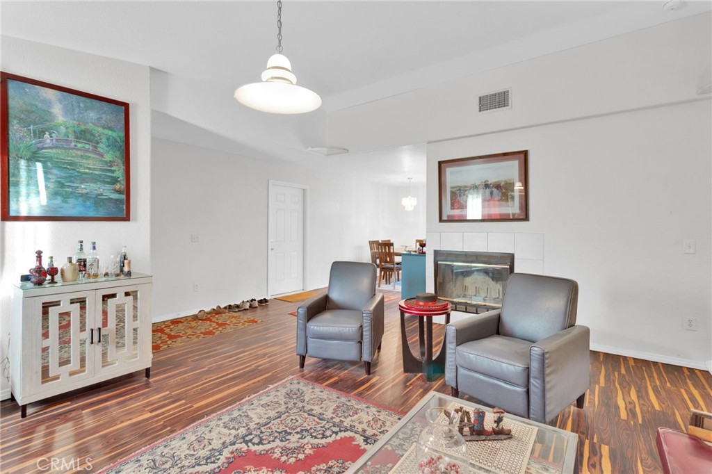 12887 Sholic Road Apple Valley, CA 92308 - Photo 5 of 47 a living room with furniture and a window
