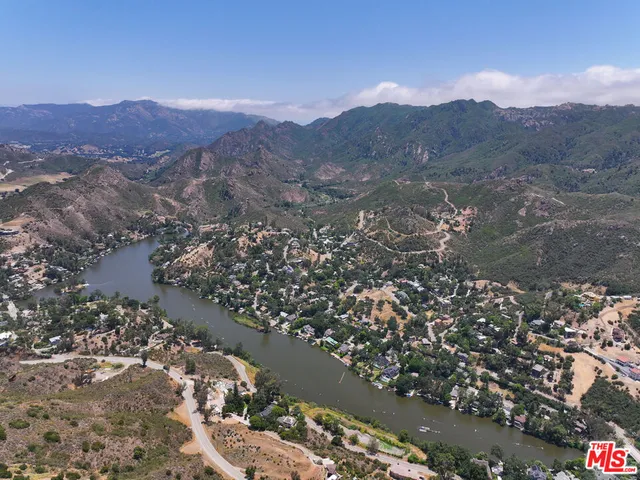 a view of a city with mountains in the background