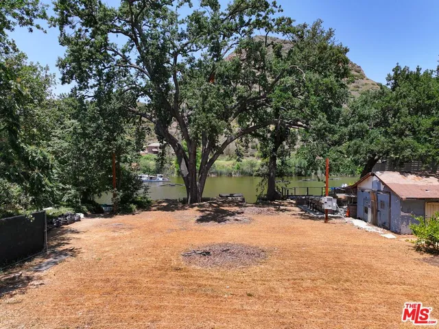 a view of a yard with snow on the road