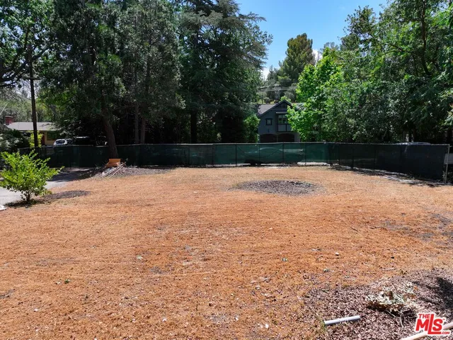 a swimming pool with wooden fence