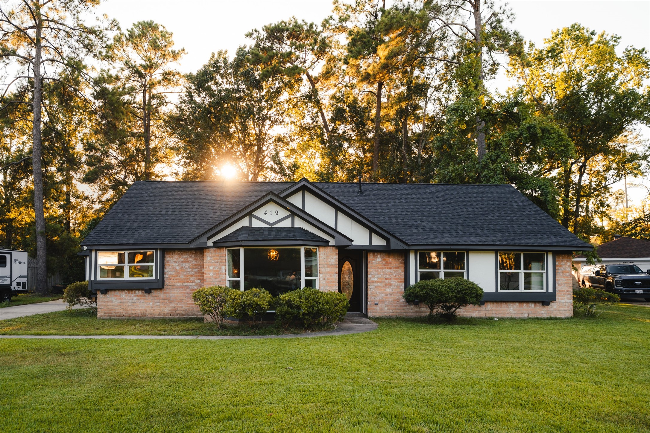 419 Magnolia Bend New Caney, TX 77357 - Photo 1 of 25 a front view of a house with a garden
