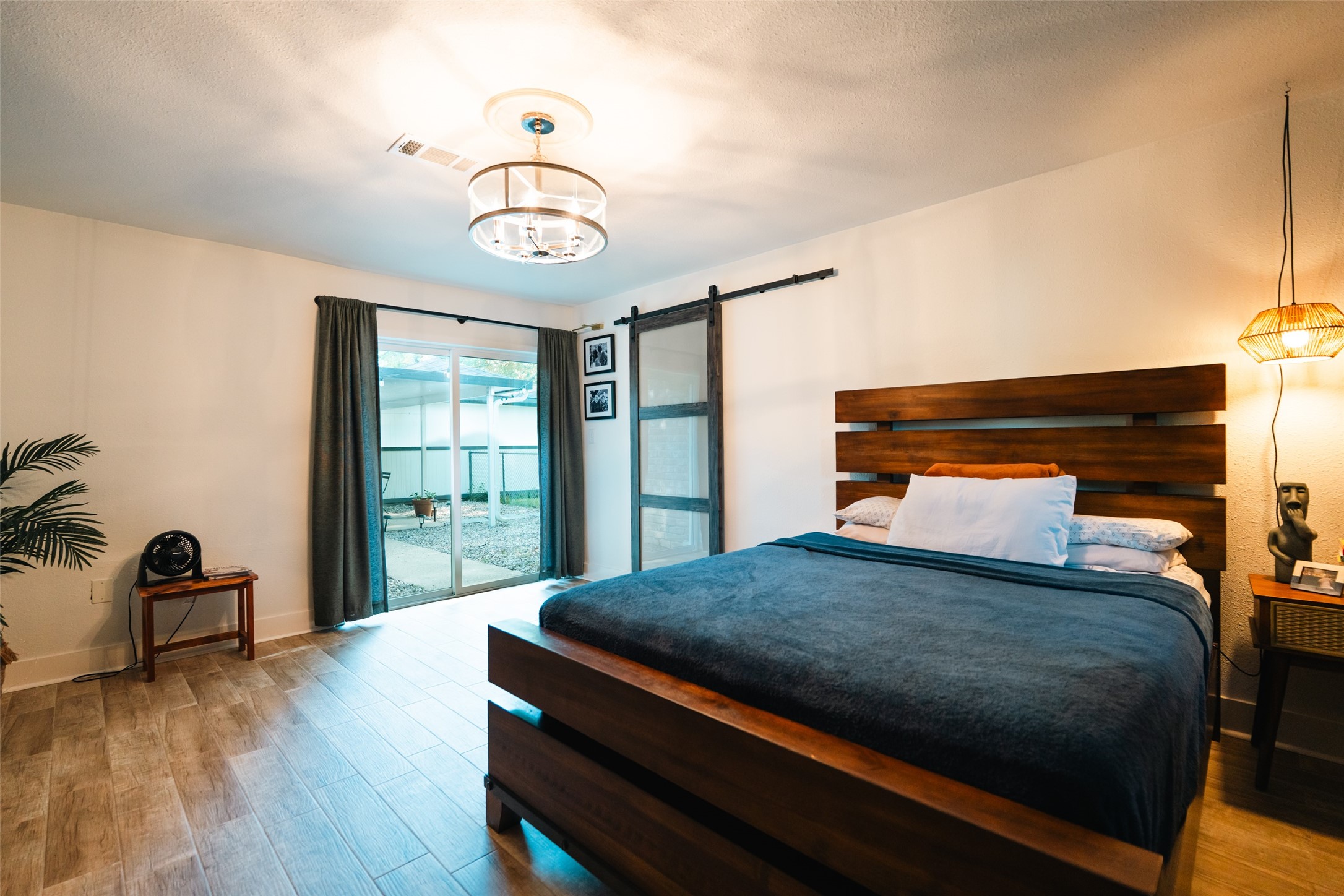 419 Magnolia Bend New Caney, TX 77357 - Photo 12 of 25 a bedroom with a bed and wooden floor