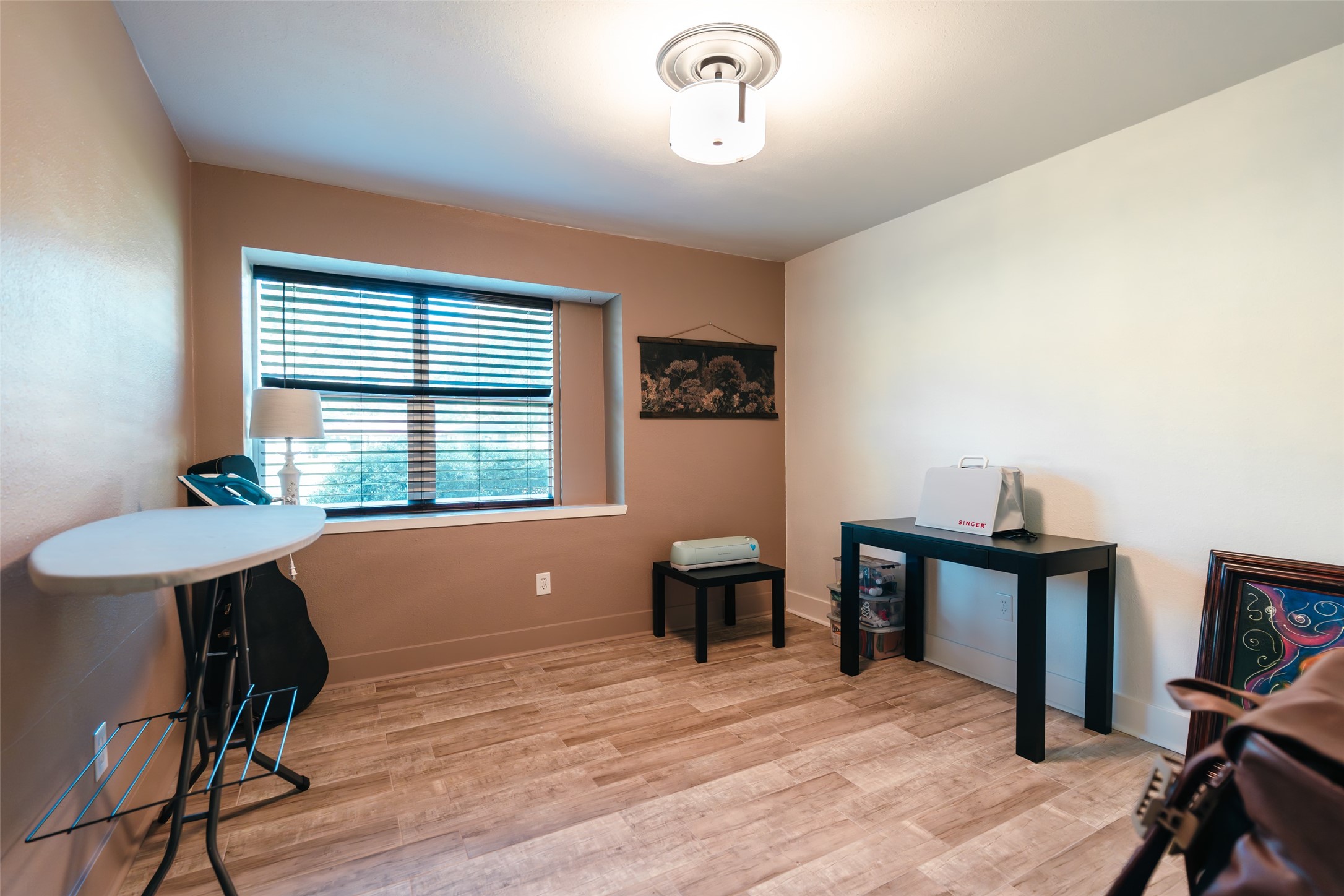 419 Magnolia Bend New Caney, TX 77357 - Photo 18 of 25 a workspace with furniture hardwood and a window