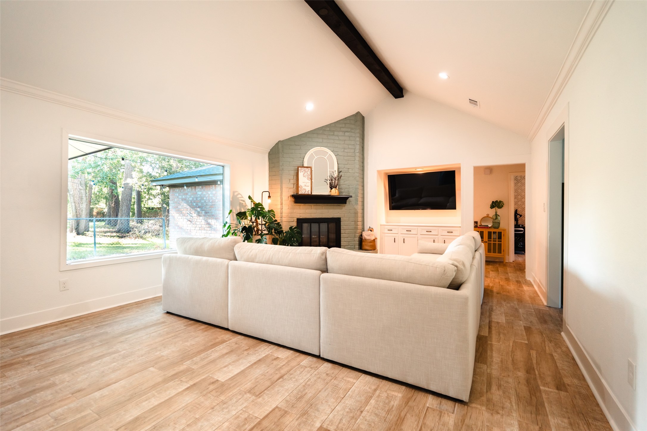 419 Magnolia Bend New Caney, TX 77357 - Photo 19 of 25 a living room with furniture and a flat screen tv