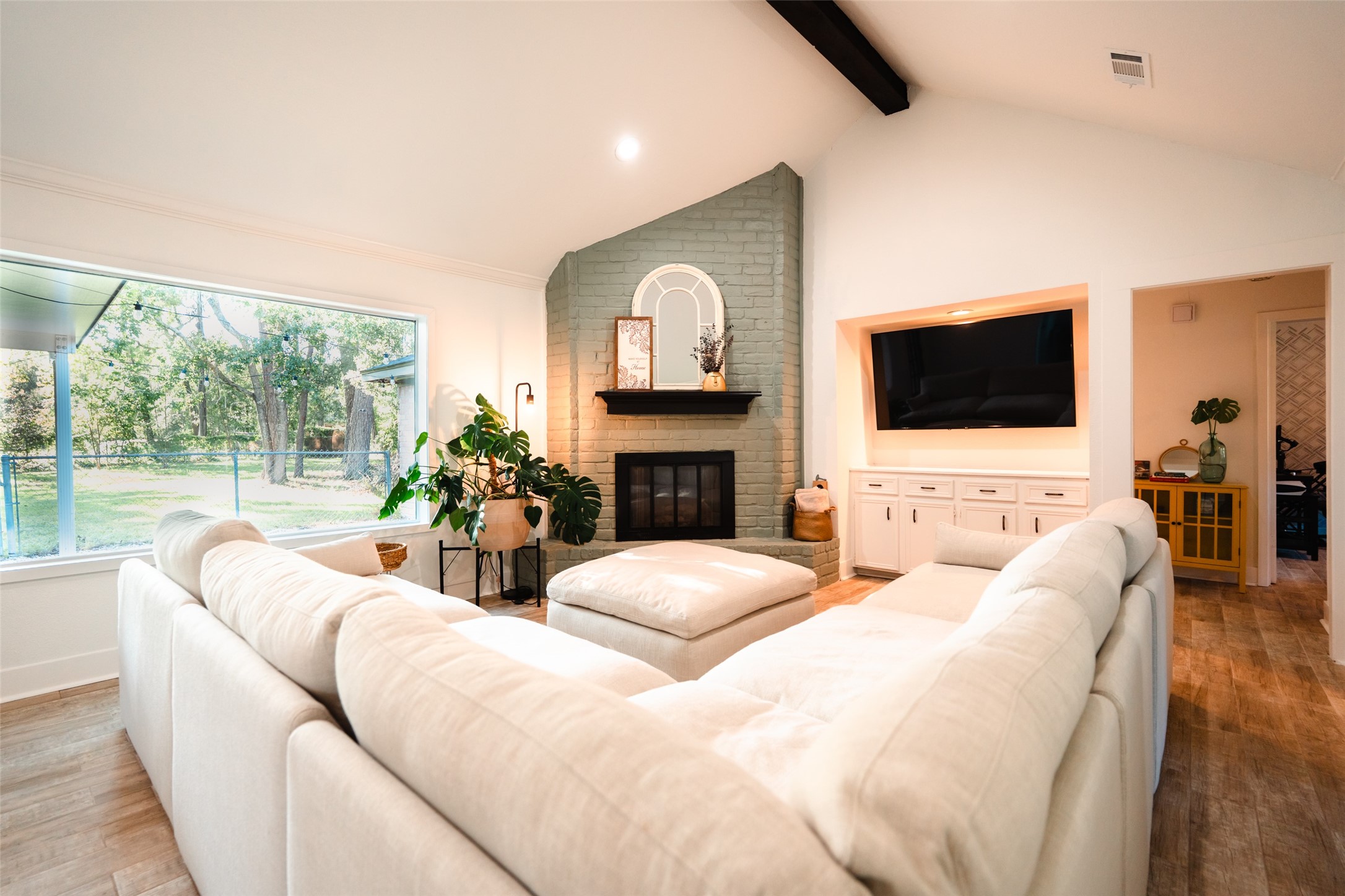 419 Magnolia Bend New Caney, TX 77357 - Photo 20 of 25 a living room with fireplace furniture and a flat screen tv